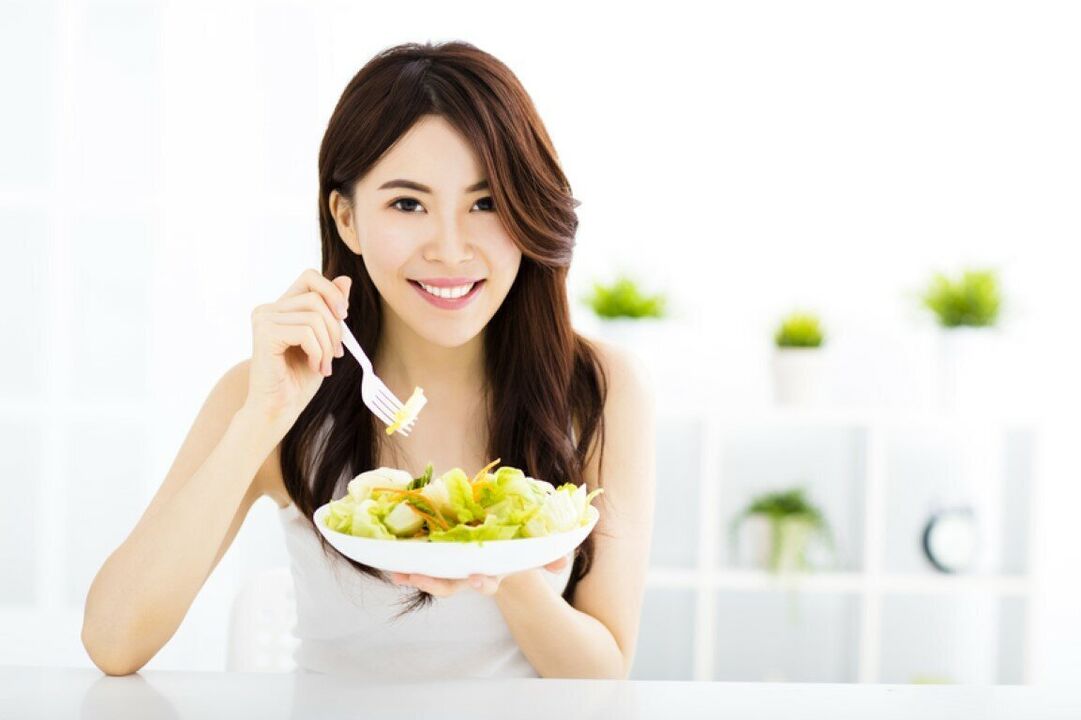 Japanese woman eats salad